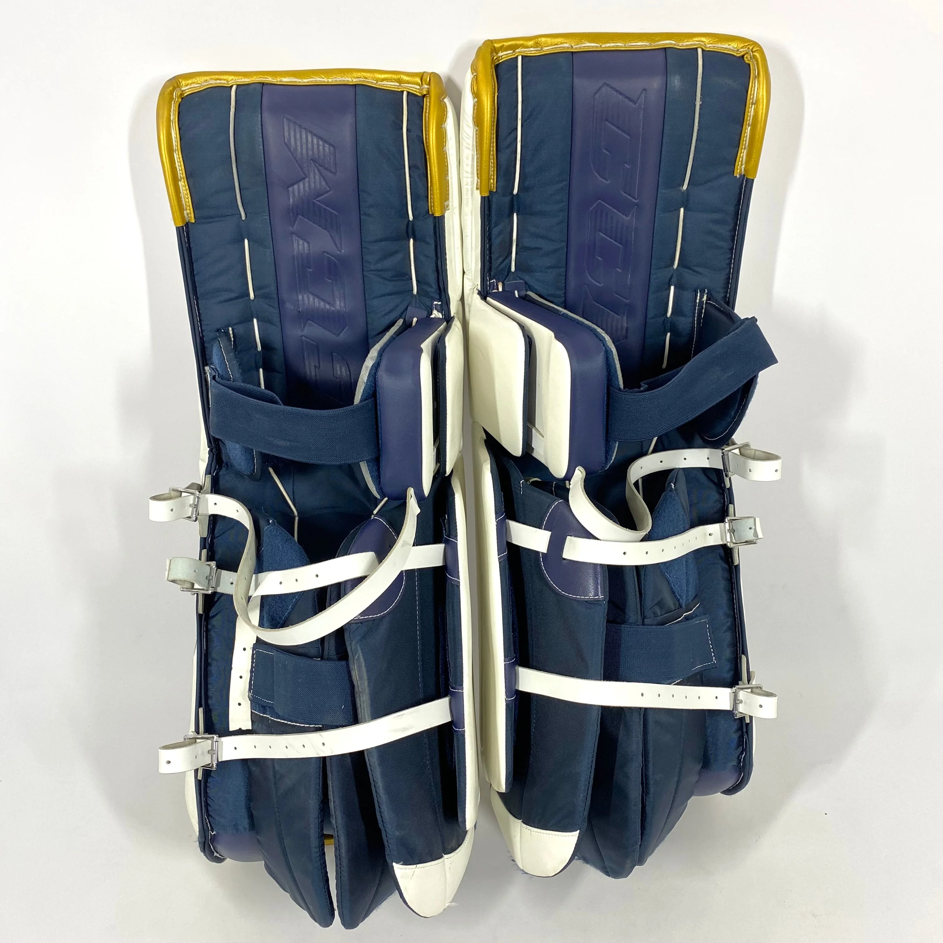 CCM Extreme Flex 5 - Used NCAA Pro Stock Goalie Pads (White/Blue/Gold) - Image 4